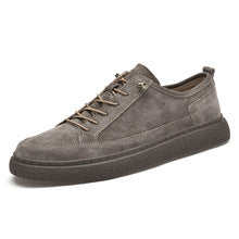 Men's casual grey suede sneaker with brown laces and black sole