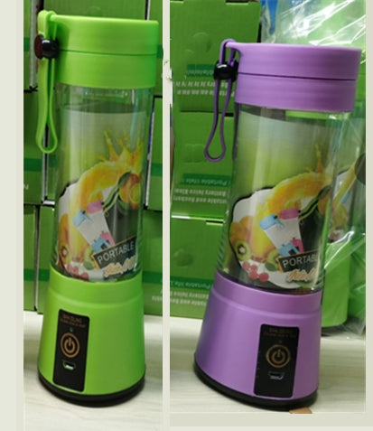 Green and purple portable blenders with power buttons and fruit graphics on clear containers