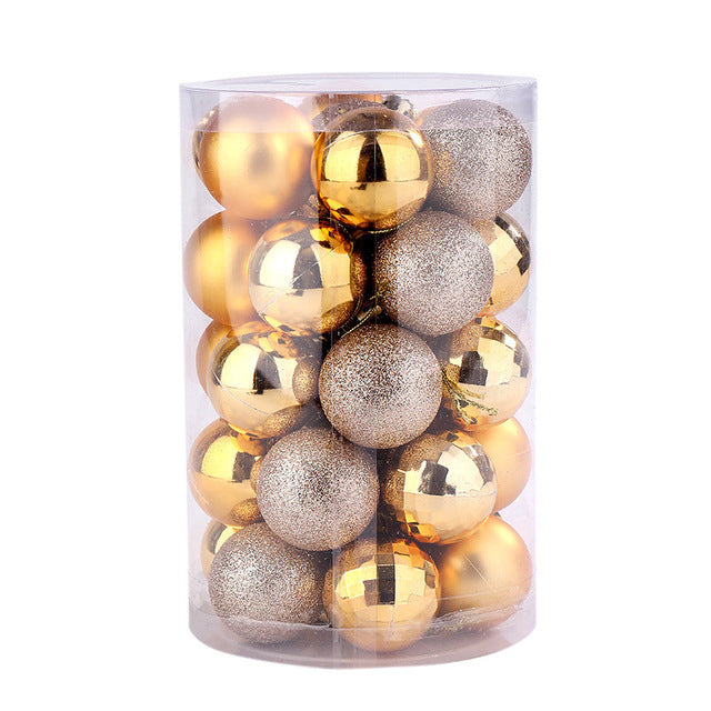 Clear cylindrical container filled with gold and glittery Christmas baubles