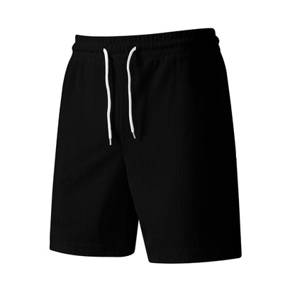 Black ribbed shorts with white drawstring waist on white background