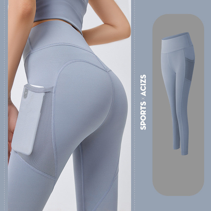 Light blue seamless high-waisted leggings with side mesh pocket holding a phone, shown on model and standalone