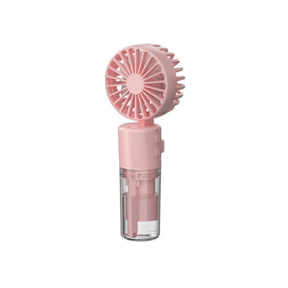 Pink portable handheld mini fan with spray mist water container on white background