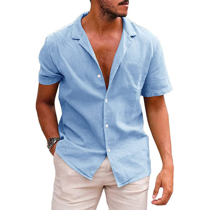 Man wearing light blue short-sleeve button-up shirt and beige pants, casual summer outfit