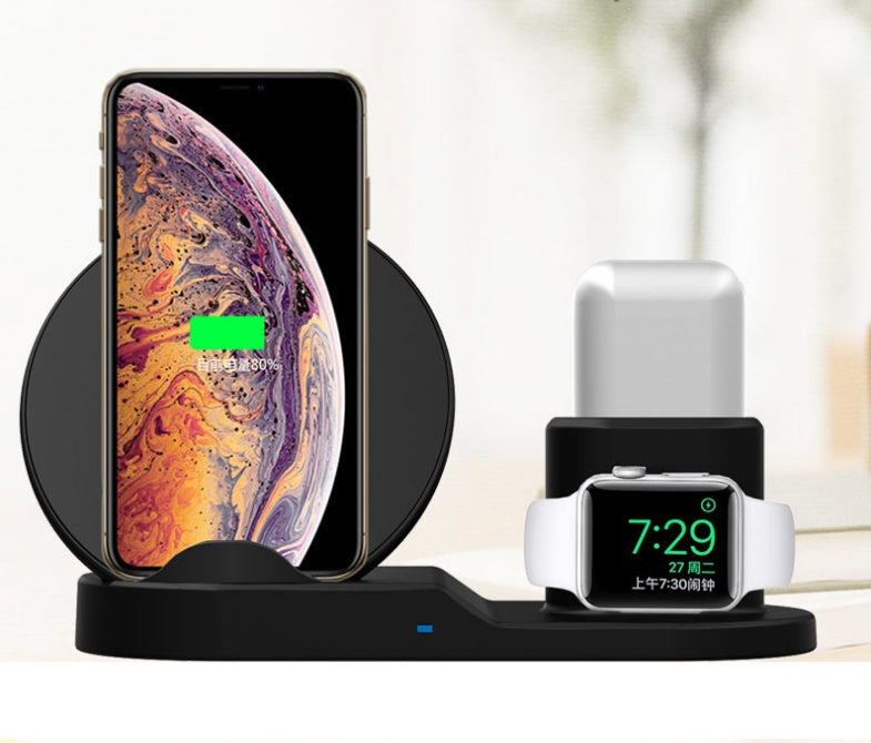 Black wireless charging station charging iPhone and Apple Watch with digital clock display