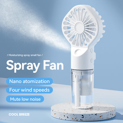 White handheld spray fan with nano atomization, four wind speeds, and mute low noise on terrazzo base