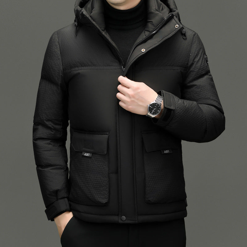 Men's black padded winter jacket with front pockets and high collar, worn with black turtleneck