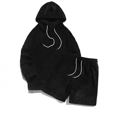 black plush hoodie and matching shorts set with white drawstrings on white background