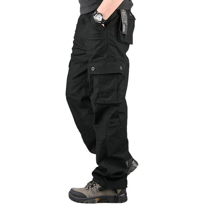 Mens black cargo pants with multiple pockets styled with black watch and grey hiking shoes