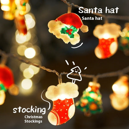 Christmas string lights featuring glowing Santa hat and red stocking decorations with festive bokeh background