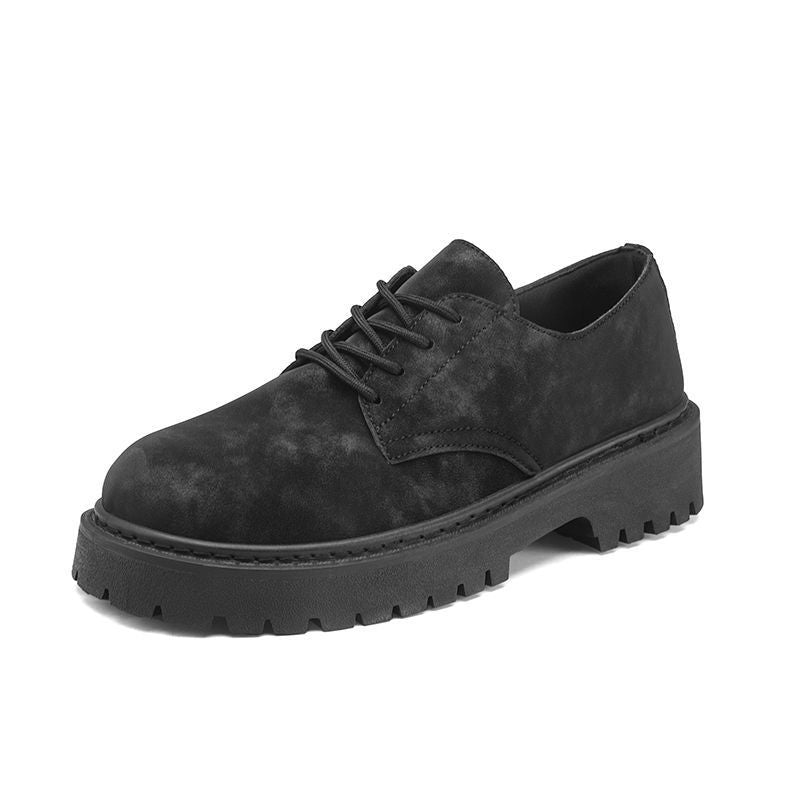 Black suede lace-up casual shoe with chunky sole and rugged tread on white background