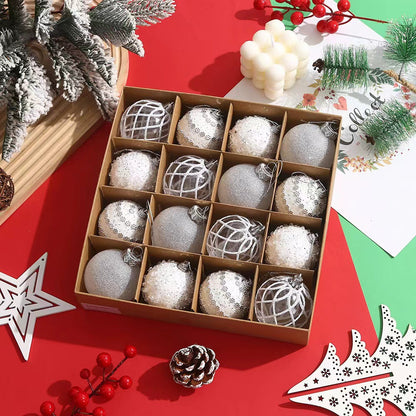 Box of silver and white Christmas baubles with festive decorations on red background