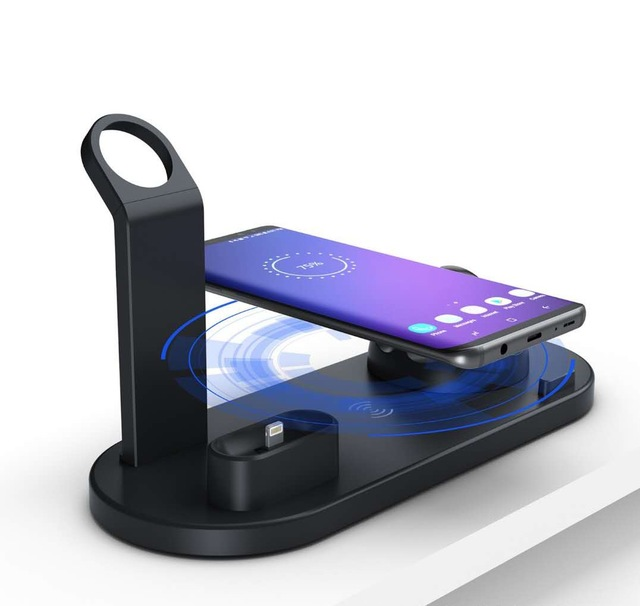 Black wireless charging station with stand holding a smartphone showing 75% charge on screen