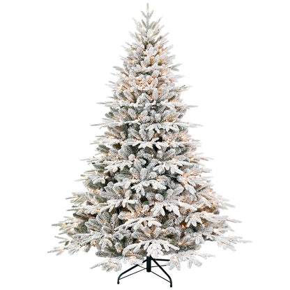 Flocked artificial Christmas tree with warm white lights on metal stand
