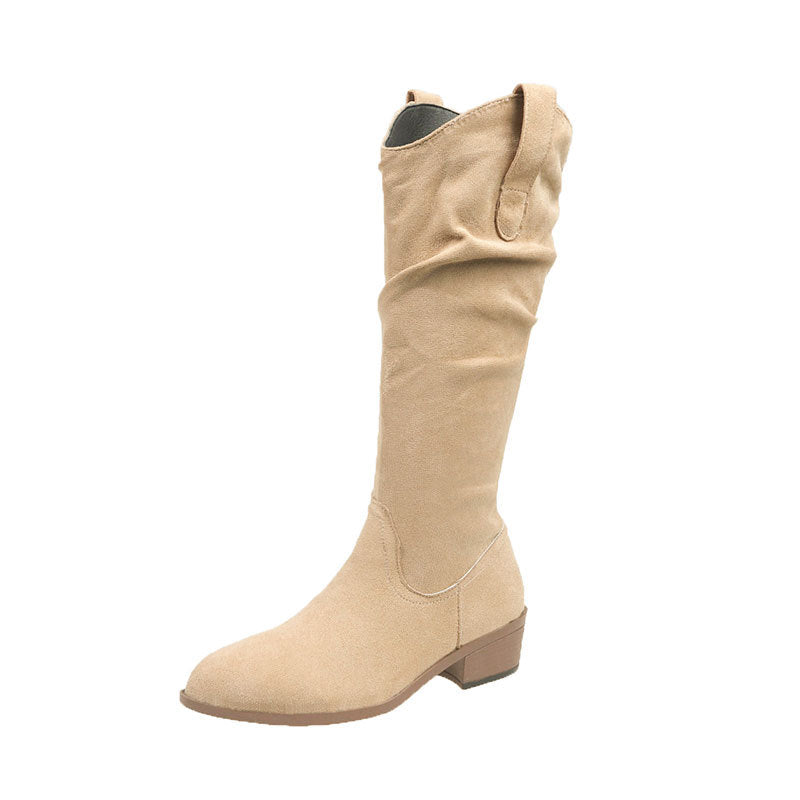 Beige suede knee-high boot with low heel and pull tabs against white background