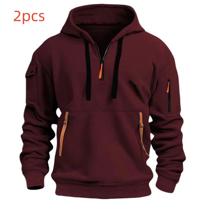 Maroon hooded sweatshirt with front zipper and multiple zippered pockets, black drawstrings, and ribbed cuffs