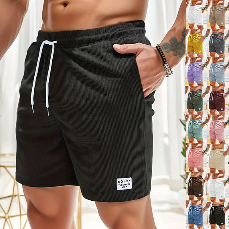 Men's casual ribbed black shorts with white drawstring and pocket detail, displayed in multiple colors