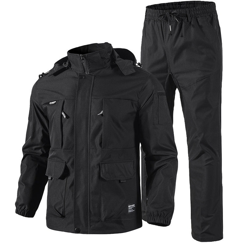 Black tactical jacket and pants set with multiple pockets and elastic cuffs on white background