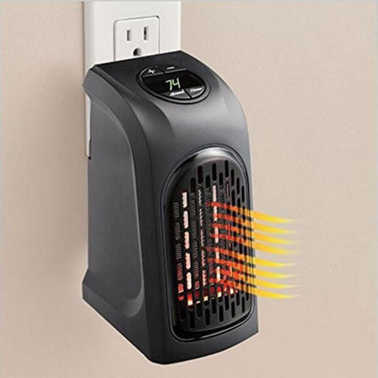 Black portable electric space heater plugged into wall outlet with digital temperature display set at 74°F