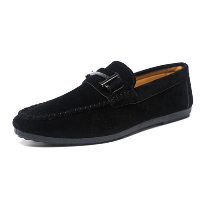Black suede men's loafer with stitch detailing and metal buckle on white background
