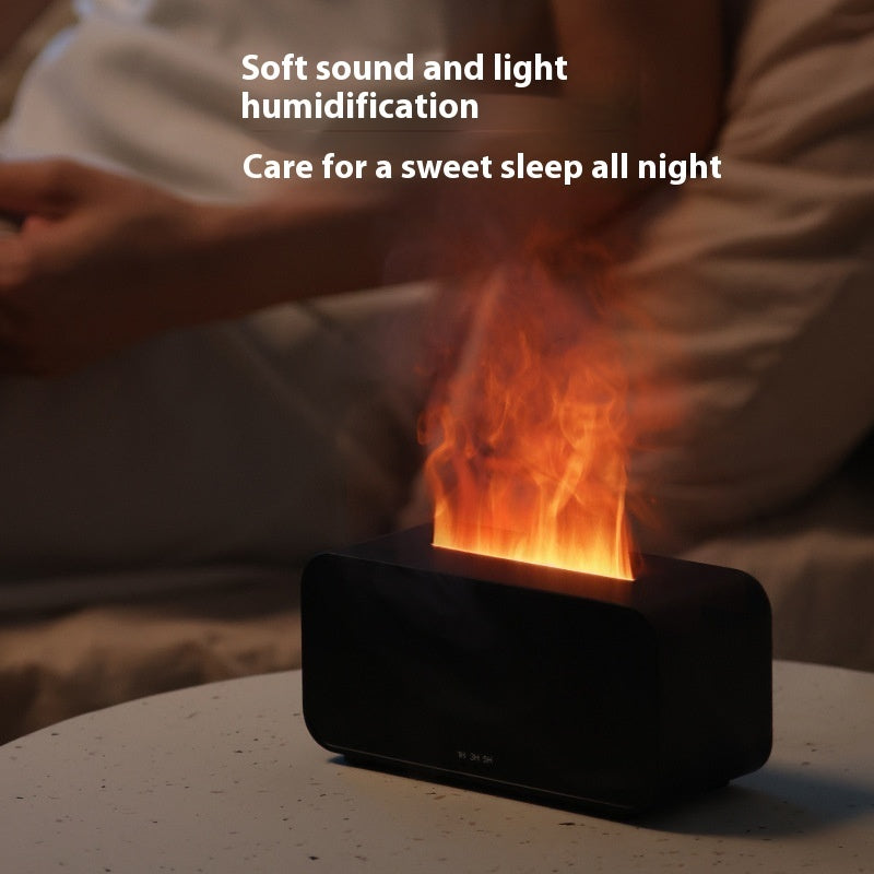 Black humidifier on table emitting warm light and mist with person resting in background