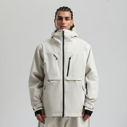 Man wearing beige waterproof hooded winter jacket with black and white zipper pockets