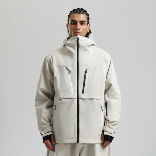 Man wearing beige waterproof hooded winter jacket with black and white zipper pockets