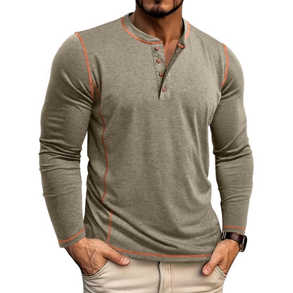 Man wearing fitted long-sleeve henley shirt with orange stitching and beige pants