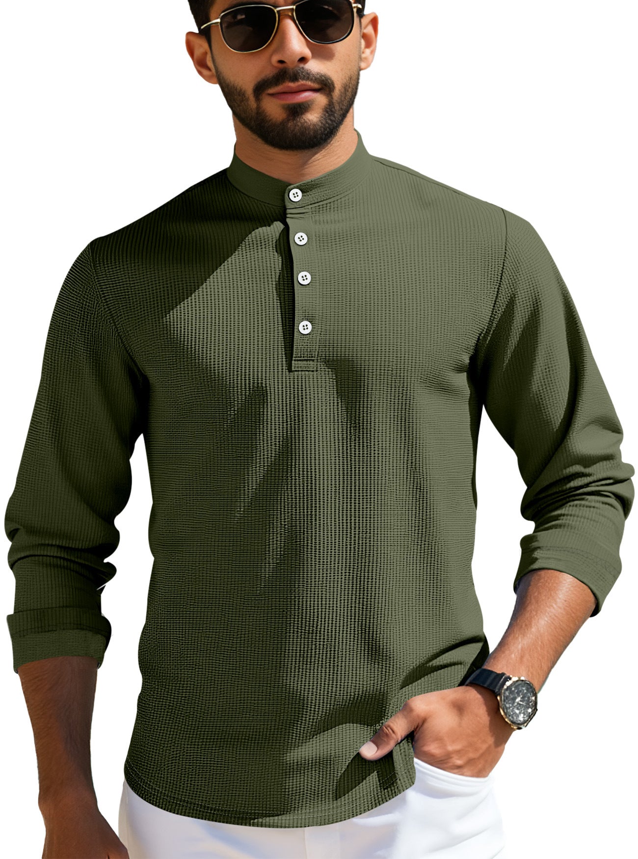Man wearing olive green textured mandarin collar shirt with white buttons and sunglasses