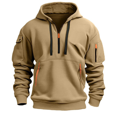 Beige hooded pullover sweatshirt with black drawstrings, front pocket zippers, and arm zip pocket