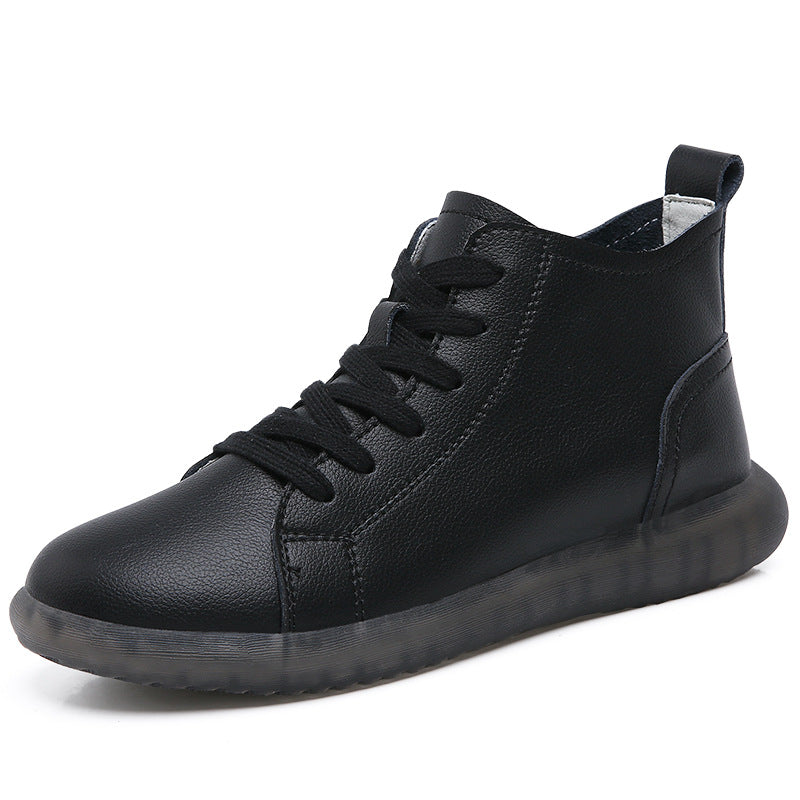 Black high-top leather sneaker with black laces and translucent rubber sole on white background