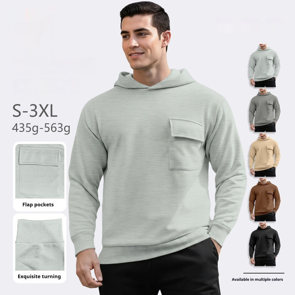 Man wearing light gray hoodie with flap pocket and ribbed cuffs, available in multiple colors