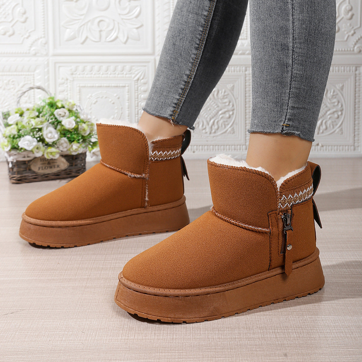 Stylish brown suede winter ankle boots with white fleece lining and zipper detail
