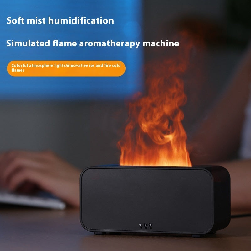Black aromatherapy humidifier with simulated flame mist on wooden desk with blurred hands typing
