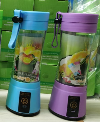 Portable electric blenders in blue and purple with fruit graphics on a display shelf