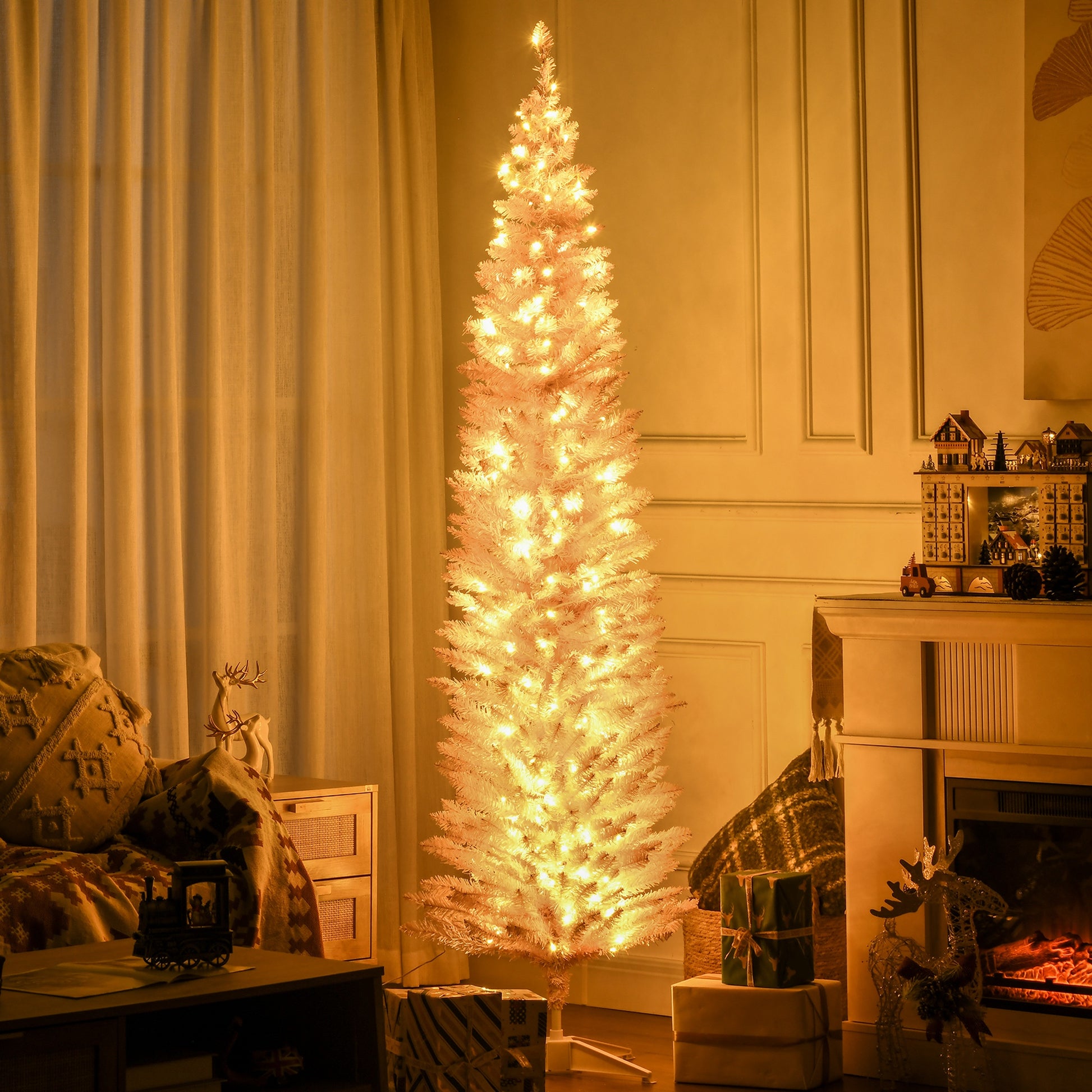Tall white Christmas tree with warm lights in cozy living room near wrapped gifts and fireplace