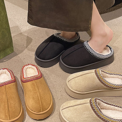 Cozy indoor slippers in black, beige, and tan with embroidered trim and soft fleece lining