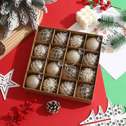 Box of gold and glitter Christmas ornaments on red surface with pine cone, berry, and festive decor