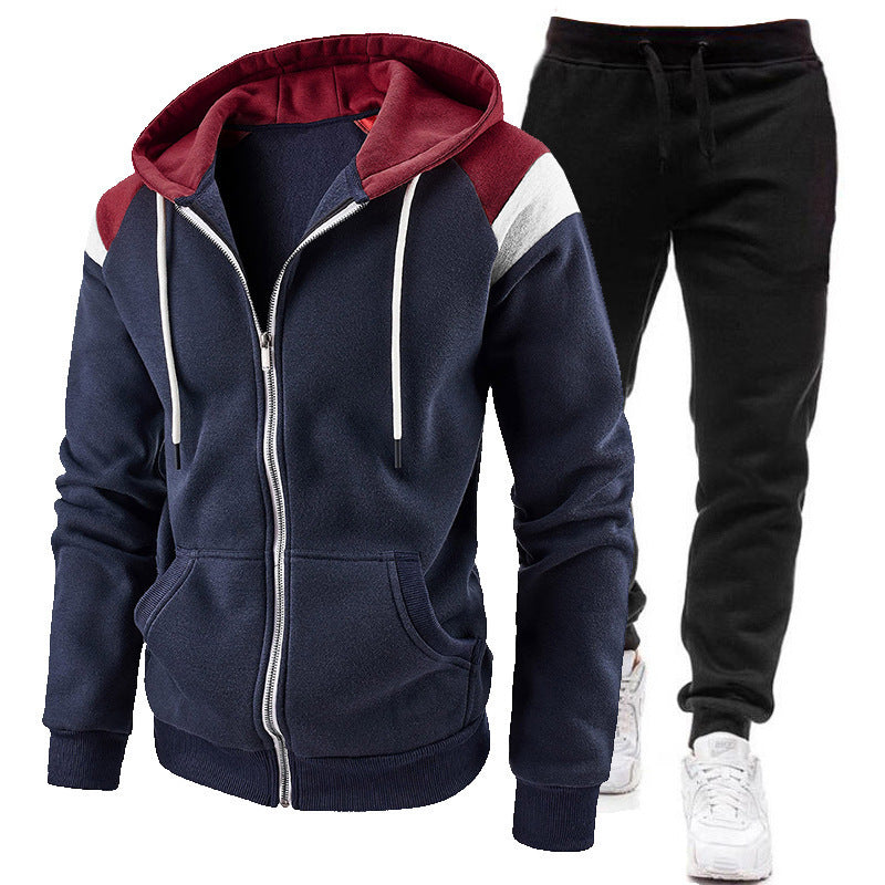 Men's navy blue zip-up hoodie with maroon hood and white stripe, paired with black jogger pants and white sneakers