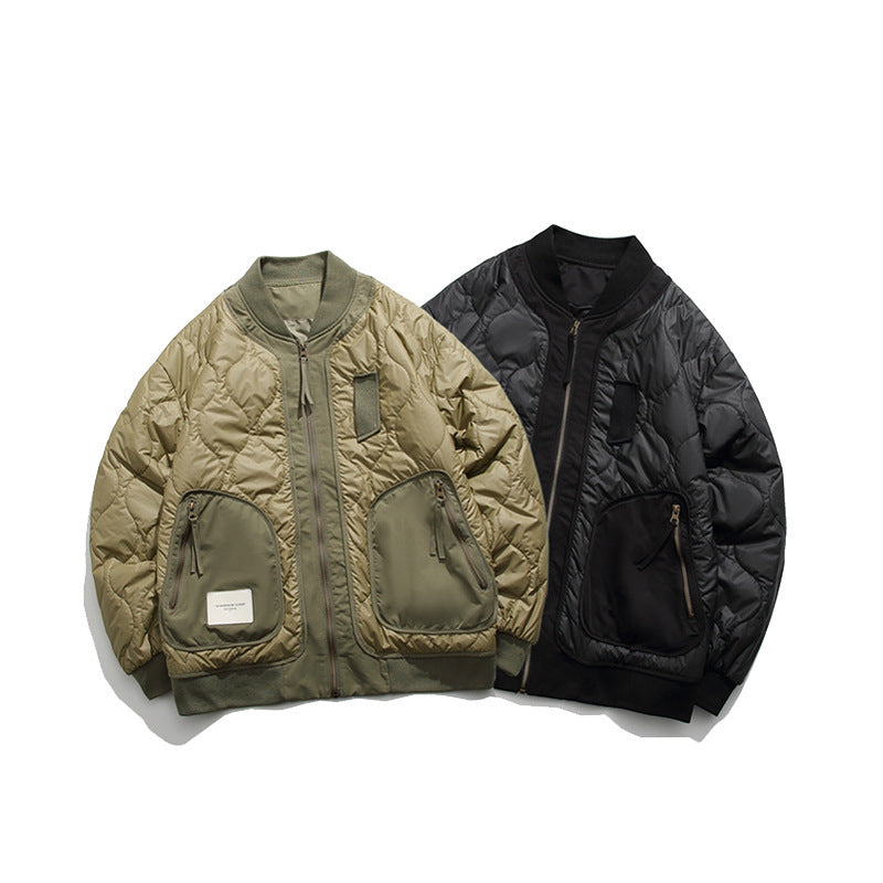 Two quilted bomber jackets in khaki and black with zippered pockets and ribbed cuffs