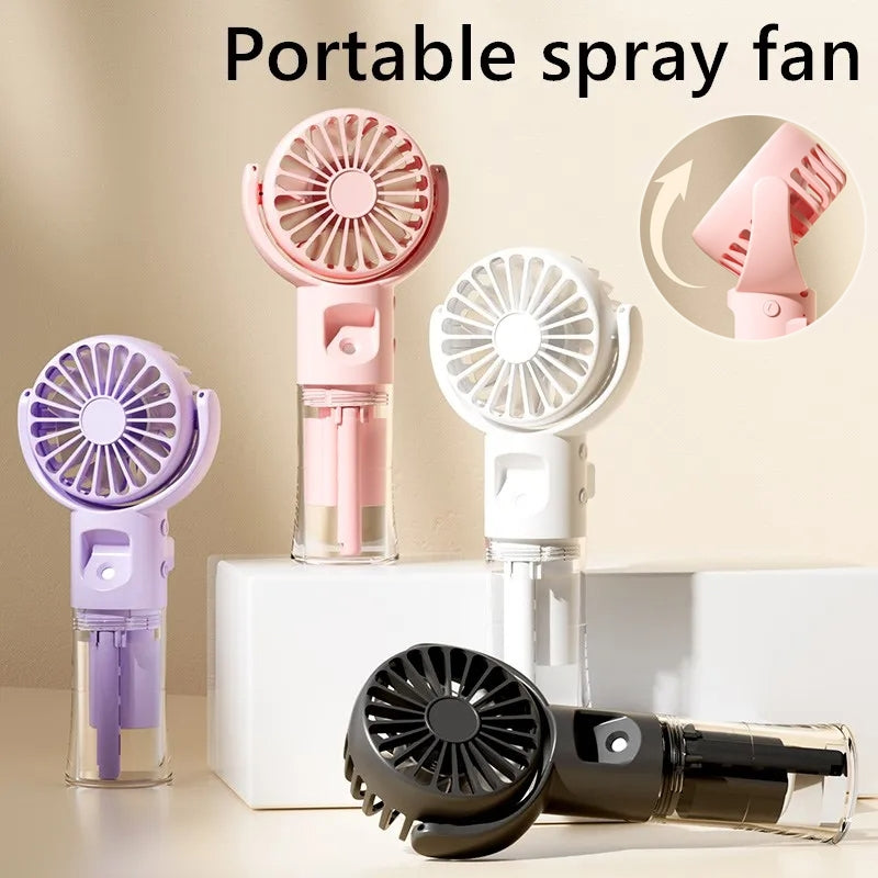 Portable spray fans in pastel pink, white, purple, and black with adjustable heads on a beige background