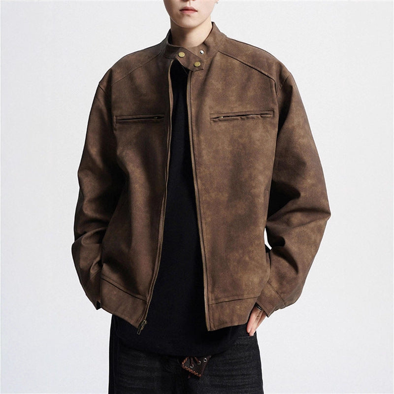 Man wearing brown suede leather jacket with zip and snap collar over black shirt