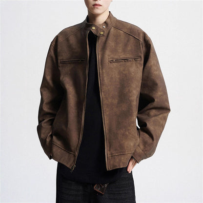Man wearing brown suede leather jacket with zip and snap collar over black shirt