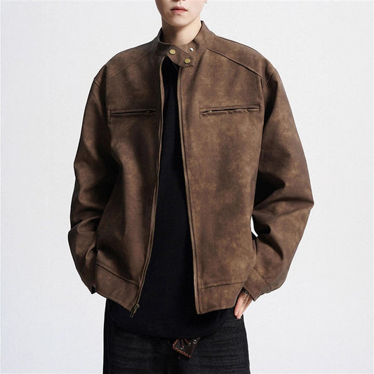 Man wearing brown suede leather jacket with zip and snap collar over black shirt