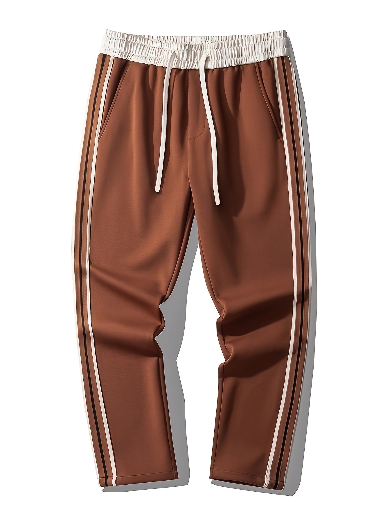 Brown track pants with white drawstring waistband and white side stripes on a white background