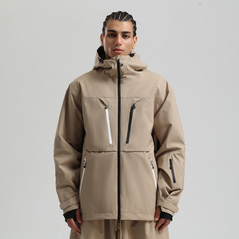 Model wearing beige waterproof outdoor jacket with multiple zip pockets and hood against plain background