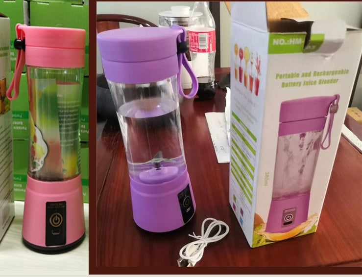Portable rechargeable battery juice blender in pink and purple with USB cable, blender box on wooden table