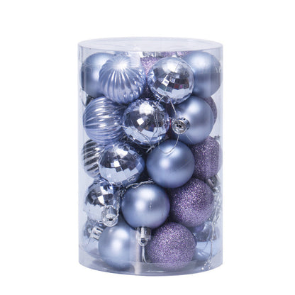 Clear cylindrical container filled with assorted silver and purple Christmas ornaments including shiny, matte, and glittery balls
