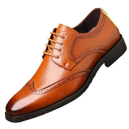 Tan brown leather men's wingtip dress shoe with brogue perforations and black sole