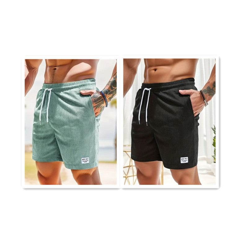 Men's casual drawstring shorts in green and black with side pockets and white logo patch