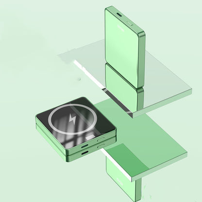 Green wireless charger with lightning bolt icon and matching green power bank on glass shelves